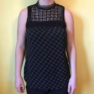 Black and white sleeveless top.